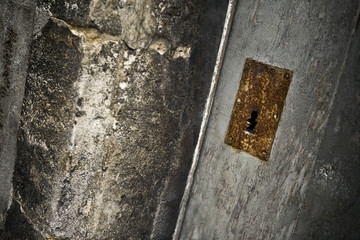 Old rusty door on the front of a slum