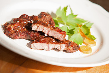 Delicous steak with vegetables on