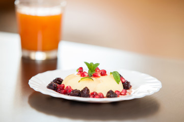 Delicious pudding with fruity topping