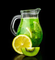 Fototapeta na wymiar drink with kiwi and lemon in a glass jug