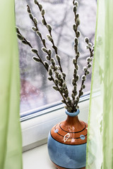 willow branches with a vase in the old style