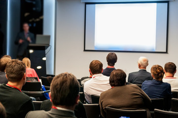 people sitting rear at the business conference