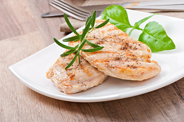 Grilled chicken breasts and vegetables