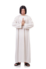 Young priest with bible isolated on white