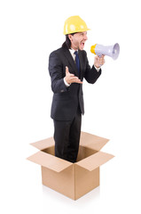 Man with hardhat and loudspeaker standing in the box
