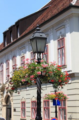 Fototapeta na wymiar Old style street lamp with flowers