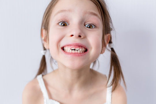 Close up portrait of preschooler girl with wide smile