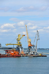 Fototapeta premium Bunker ship (fuel replenishment tanker) under port crane