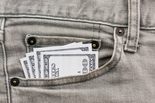 dollars in grey jean pocket