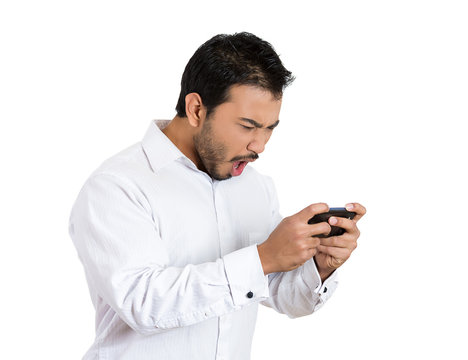 Bad text message. Angry man reading email on smart phone