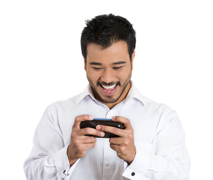 Happy text message. Phone addicted young man, browsing net