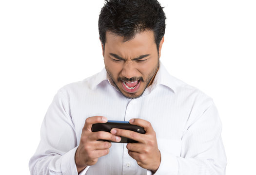 Bad text message. Angry man reading email on smart phone