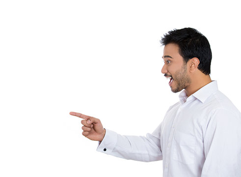 Smiling, laughing man pointing finger at someone on white 