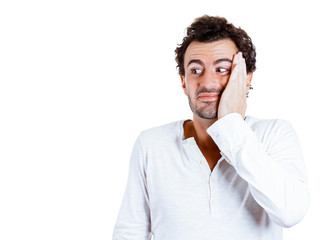 Surprised man looking sideway on white background 