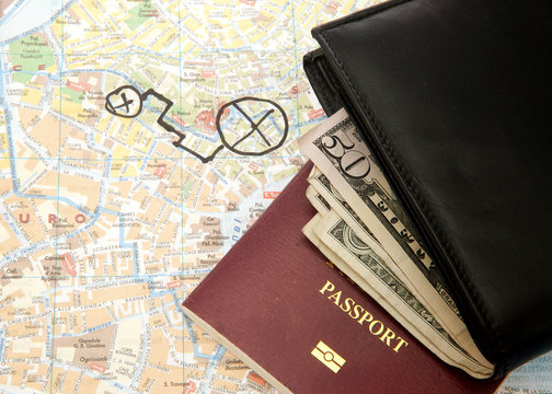 Travel Arrangement of Wallet Dollar notes passport and Map