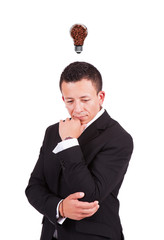 Contemplating businessman with coffee bulb over his head