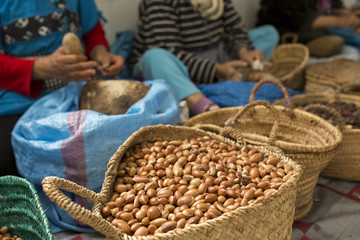 Woman working on argan oil factory in Morocco