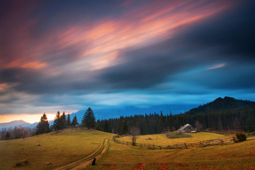Fototapeta premium Traditional house in mountain with clouds moving