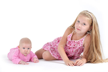 adorable little two sisters 8 year and 3 month old on white back