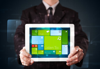 Businessman holding a tablet with modern software operational sy