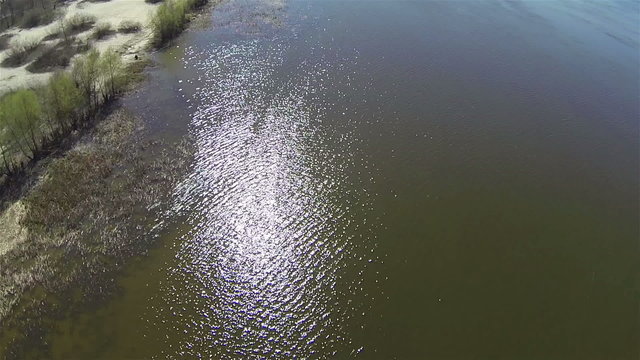 Solar reflections on  river surface. Aerial