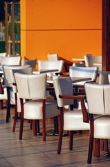Street cafe with soft seat cushion chairs