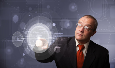 Businessman touching abstract high technology circular buttons