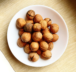 Walnuts on a white plate