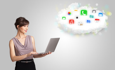 Young woman presenting cloud with colorful app icons and symbols