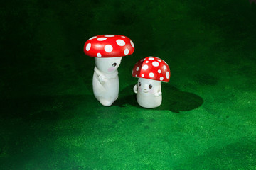 two cute puppets handmade, green background