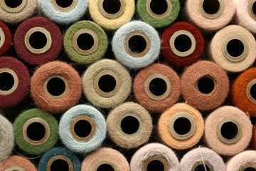 Fototapeta premium Collection of Natural Colored Vintage Yarn Spools Background