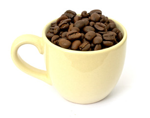 Coffee cup with coffee beans on white