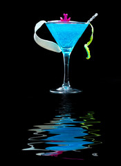 Blue swimming pool Cocktail with caviar and flower petals