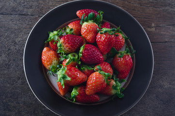 strawberries  on  black dish