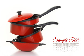 Red cookware set on white background