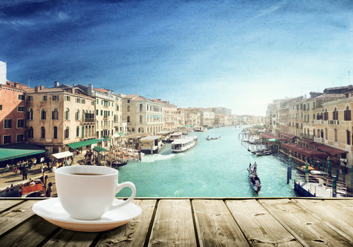 Fototapeta coffee on table and Venice in sunset time, Italy