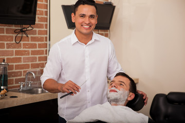 Happy barber ready to shave