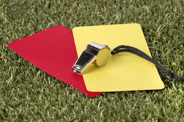 Whistle With Red And Yellow Card On The Field