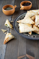 Baked stuffed pastry. Samosa.