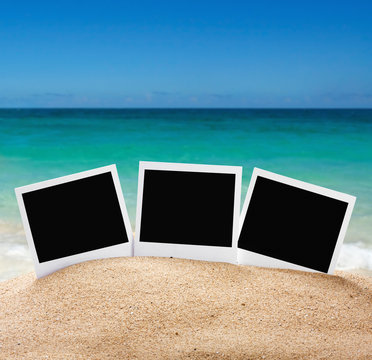 photo frames on the sea sand on the beach