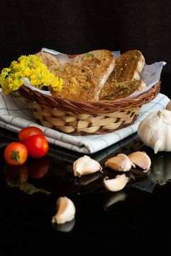 Fresh Garlic Bread With Herbs In Basket