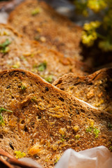 fresh garlic bread with herbs in basket