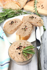 Fresh pate with bread on wooden table