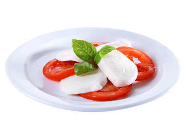 Caprese salad with mozarella cheese, tomatoes and basil