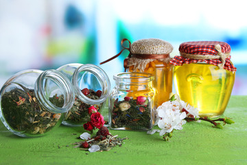 Assortment of herbs and tea in glass jars