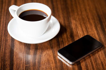 Fototapeta na wymiar Smart phone with coffee