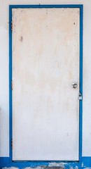 old white door with blue jamb