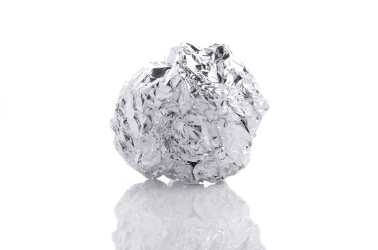 crumpled aluminum foil ball isolated on white background
