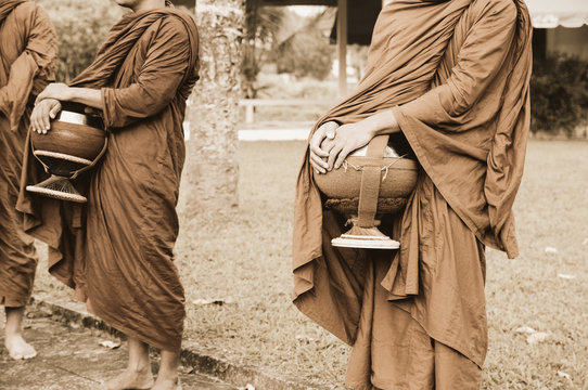 Buddhist monks holding give alms bowl on everyday morning traditional alms giving