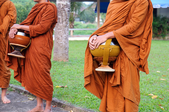 Buddhist monks holding give alms bowl on everyday morning traditional alms giving